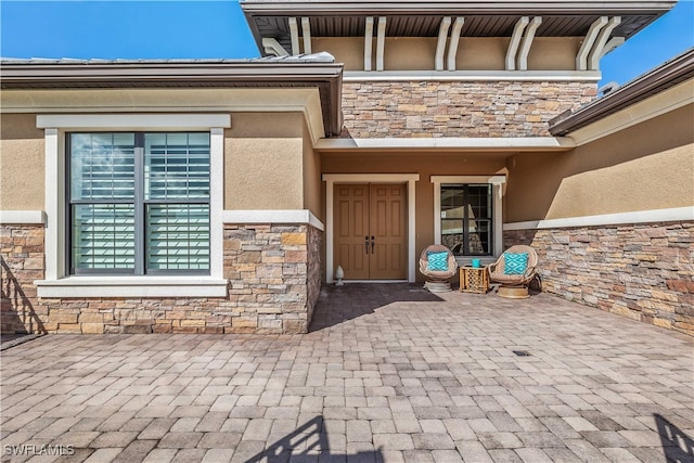 property entrance with a patio area