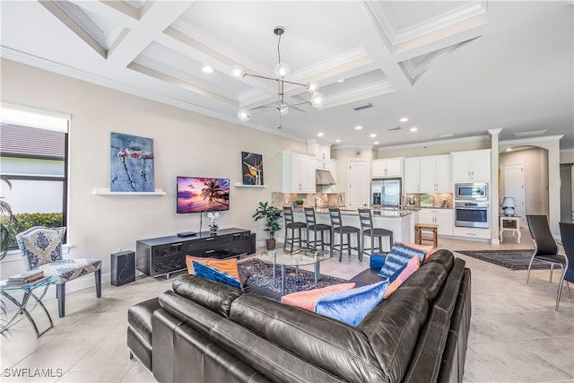 living room with coffered ceiling, beam ceiling, and crown molding