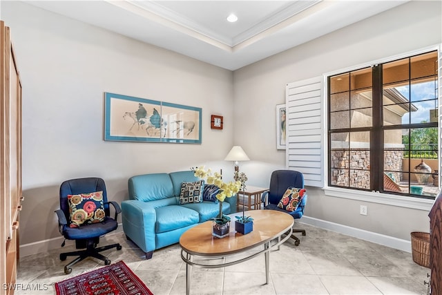 living room featuring light tile patterned floors, ornamental molding, and a raised ceiling