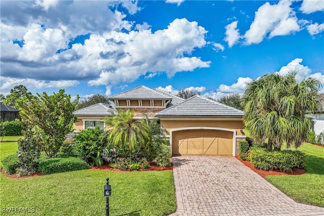 view of front of house with a garage and a front yard