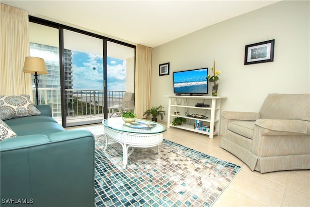 living room featuring a wall of windows and tile patterned floors