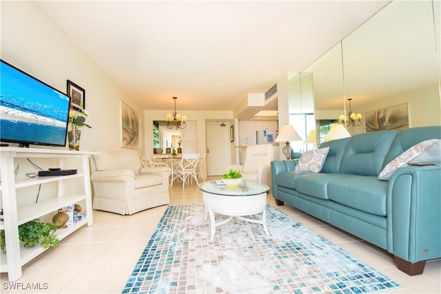 tiled living room featuring a notable chandelier