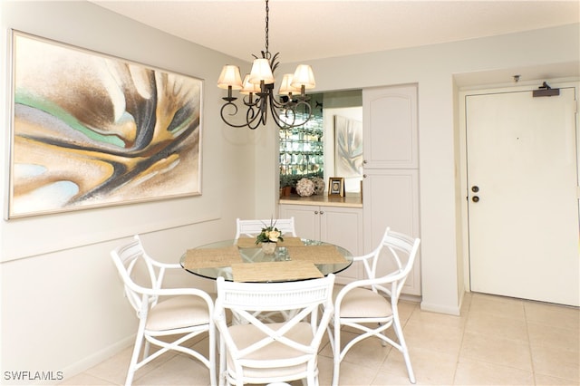 dining room featuring light tile patterned flooring and a notable chandelier