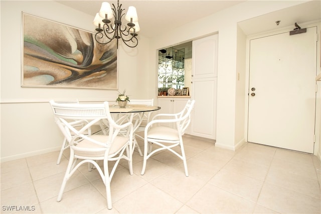 tiled dining space featuring a notable chandelier