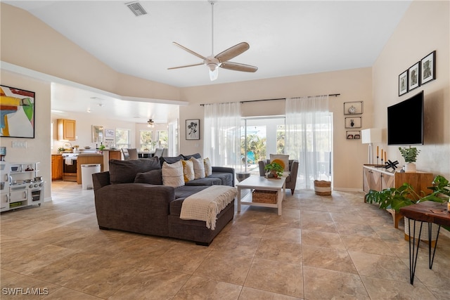 living room with vaulted ceiling and ceiling fan