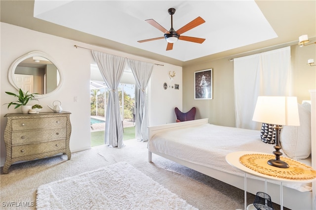 carpeted bedroom with access to outside and ceiling fan