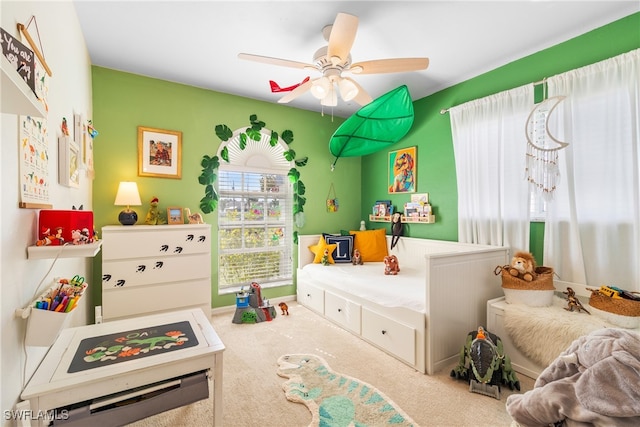 carpeted bedroom with ceiling fan