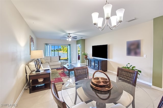 living room with ceiling fan with notable chandelier