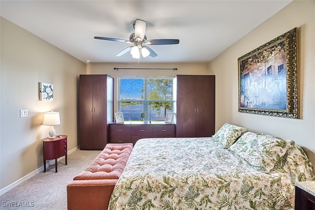 bedroom with light colored carpet and ceiling fan