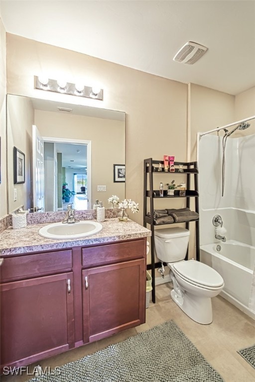 full bathroom featuring vanity, tile patterned floors, toilet, and shower / bathtub combination