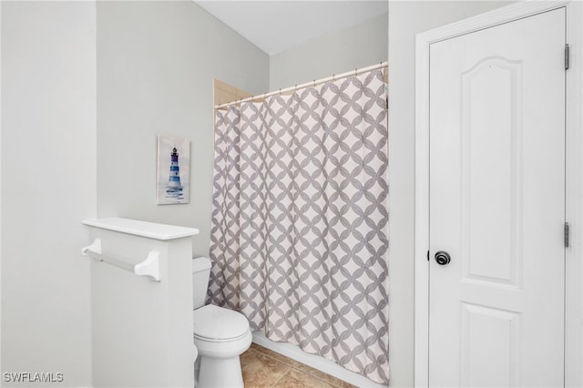 bathroom featuring tile patterned flooring and toilet