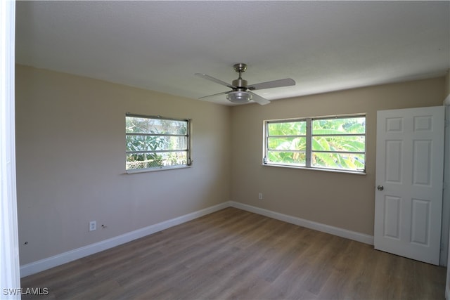 unfurnished room featuring hardwood / wood-style floors and ceiling fan