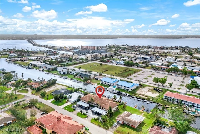 birds eye view of property with a water view