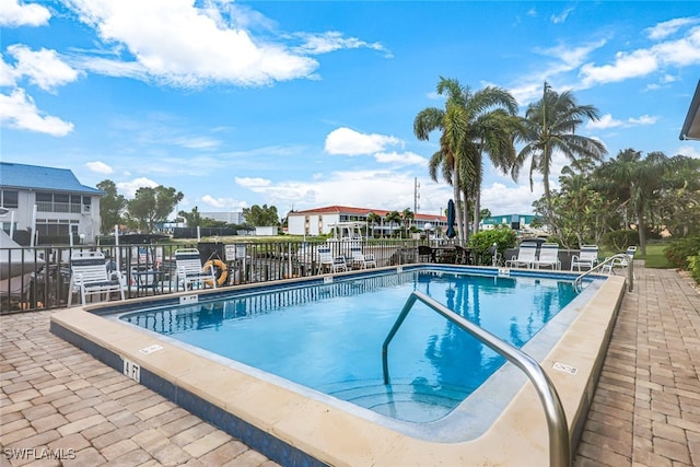 view of swimming pool featuring a patio