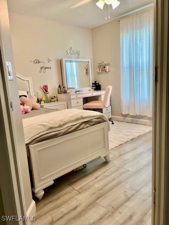 bedroom featuring light wood-type flooring and ceiling fan