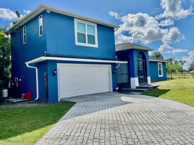 front of property featuring a garage and a front yard