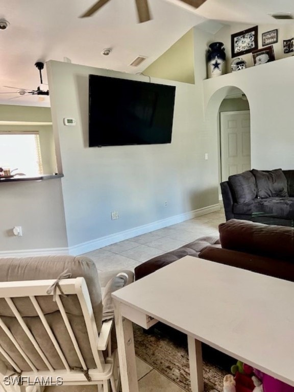 tiled living room with ceiling fan