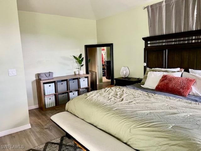 bedroom with hardwood / wood-style flooring