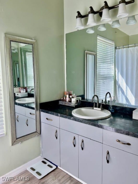 bathroom featuring vanity and hardwood / wood-style flooring