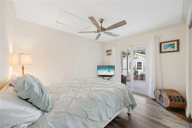 bedroom with access to exterior, crown molding, hardwood / wood-style floors, and ceiling fan