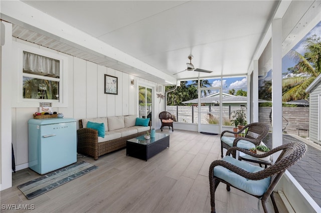 sunroom / solarium with ceiling fan