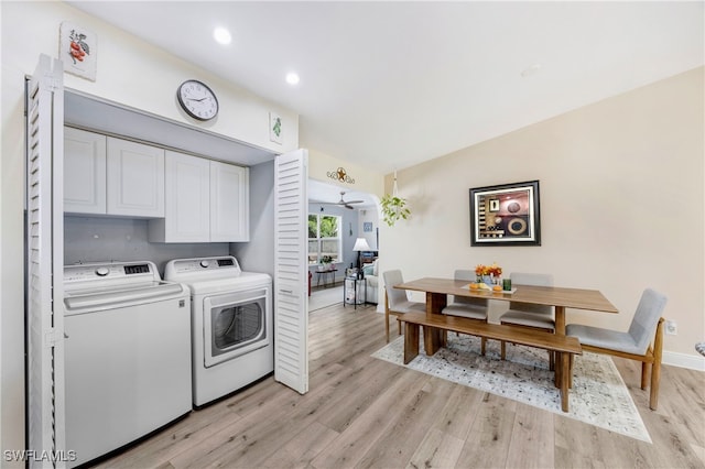 washroom with independent washer and dryer, light hardwood / wood-style floors, cabinets, and ceiling fan