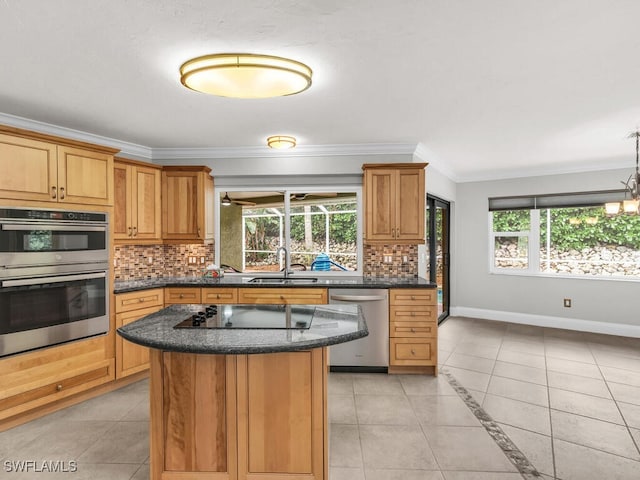 kitchen featuring a wealth of natural light, appliances with stainless steel finishes, decorative backsplash, and a kitchen island