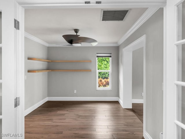 spare room featuring ornamental molding, dark hardwood / wood-style flooring, and ceiling fan