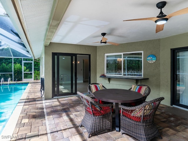 view of patio / terrace with a lanai and ceiling fan