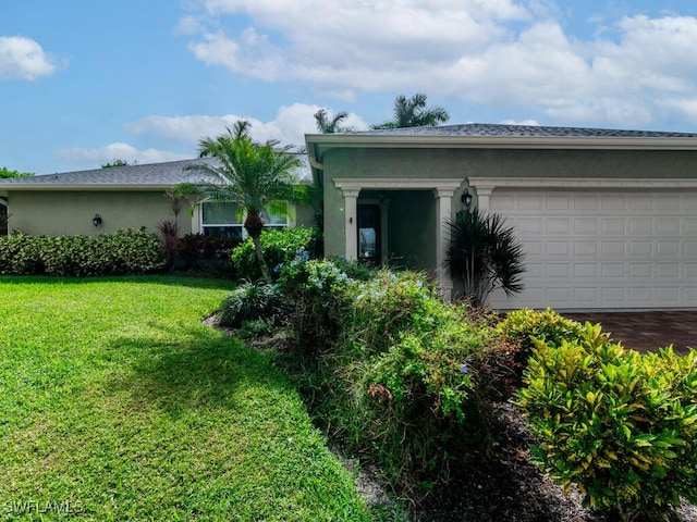 exterior space with a garage and a yard