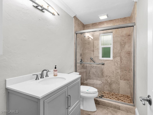 bathroom featuring toilet, vanity, tile patterned flooring, and walk in shower