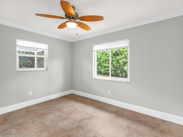 spare room with ceiling fan and crown molding