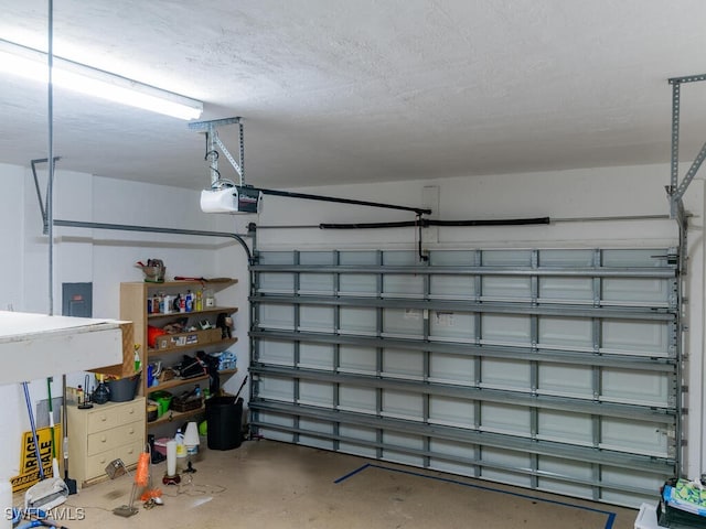 garage with electric panel and a garage door opener