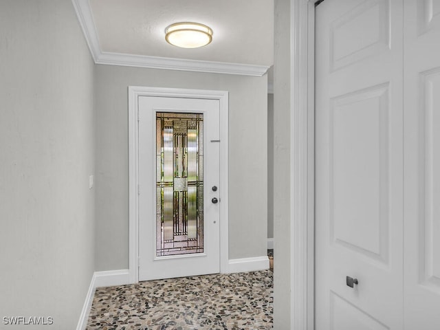 entryway featuring crown molding