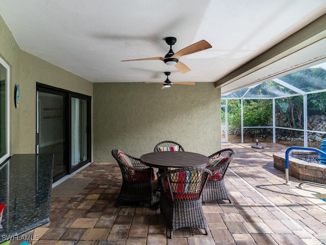 view of patio / terrace with glass enclosure and ceiling fan