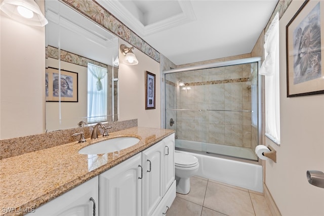 full bathroom featuring vanity, toilet, a healthy amount of sunlight, and bath / shower combo with glass door