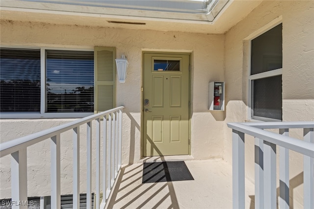 property entrance with a balcony