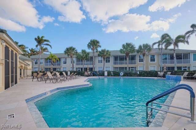 community pool with a patio area