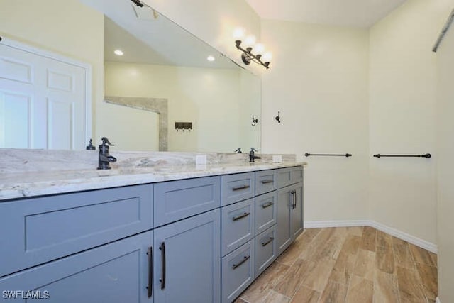 bathroom featuring vanity and hardwood / wood-style flooring