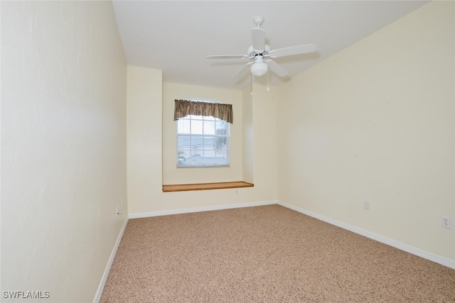 unfurnished room featuring ceiling fan and carpet floors