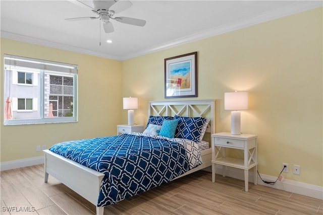 bedroom featuring ceiling fan and ornamental molding