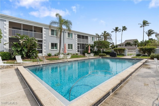 view of swimming pool featuring a patio