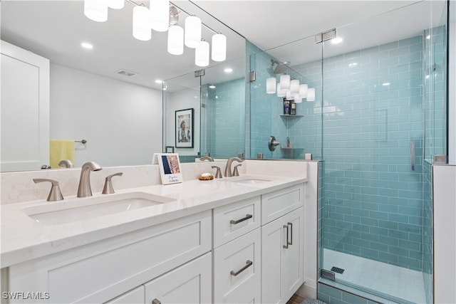 bathroom with vanity and an enclosed shower