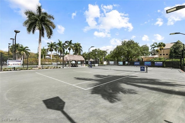 view of sport court with basketball hoop