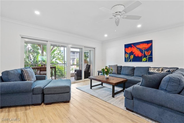 living room with crown molding, light hardwood / wood-style flooring, and ceiling fan