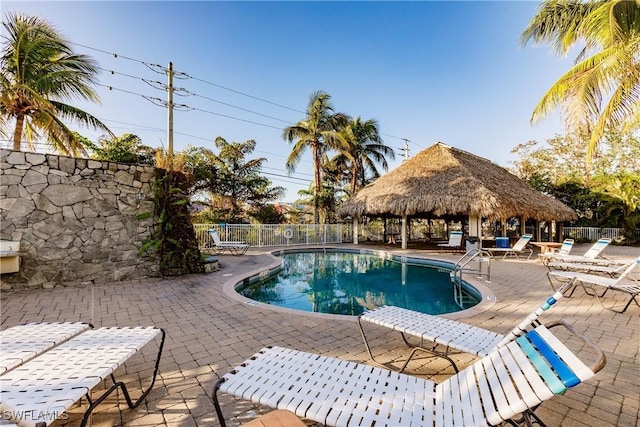 view of swimming pool featuring a gazebo and a patio