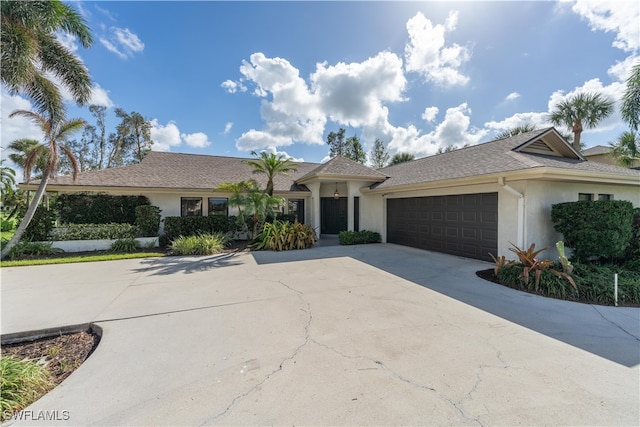 ranch-style house featuring a garage