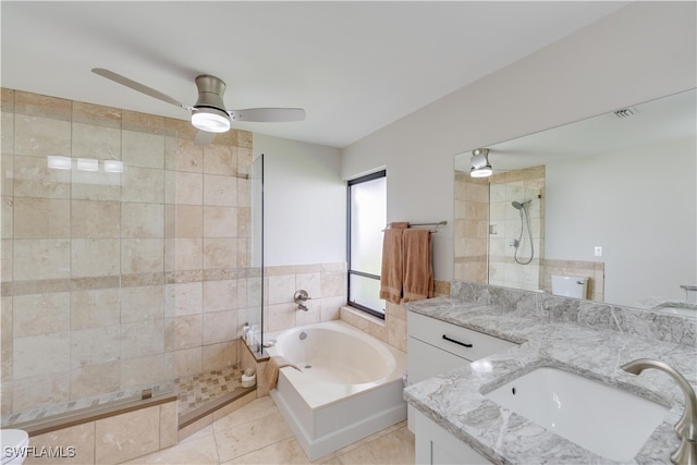 bathroom featuring tile patterned flooring, vanity, tile walls, and plus walk in shower