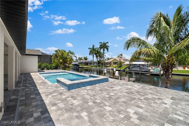 view of swimming pool featuring a water view, a dock, and a patio area