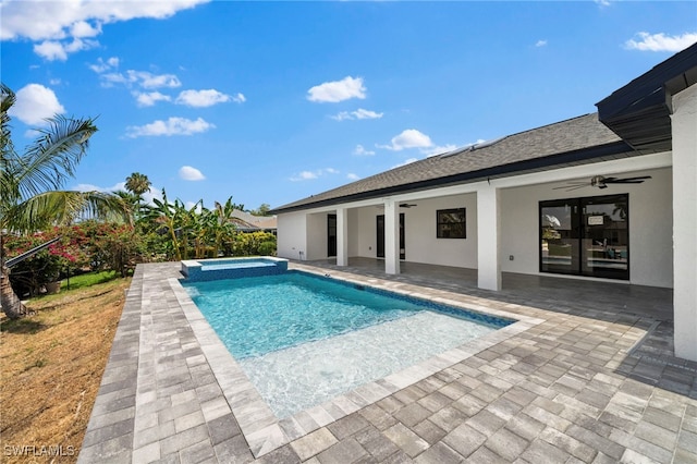 view of pool featuring ceiling fan, an in ground hot tub, and a patio